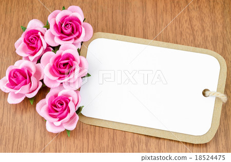 Blank paper tag and pink roses 18524475