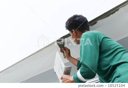 Man plastering concrete to shape the edge Man plastering concrete to shape the edge 18525104