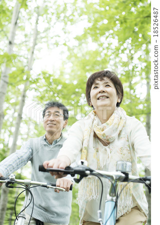 Senior couple riding a bicycle 18526487