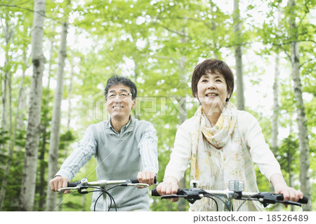 Senior couple riding a bicycle 18526489