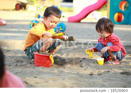 Children playing sandbag with friends 18526903