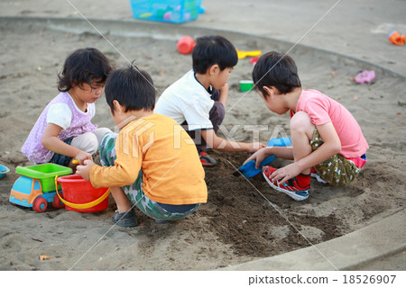 Children playing sandbag with friends 18526907