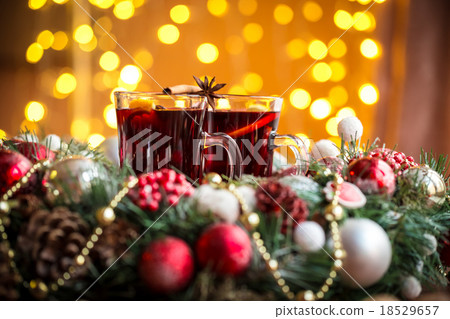 Christmas hot mulled wine with spices on a wooden  Christmas hot mulled wine with spices on a wooden  18529657