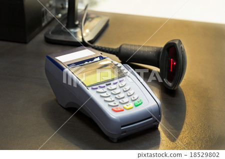 Credit Card Machine on cashier counter Credit Card Machine on cashier counter 18529802