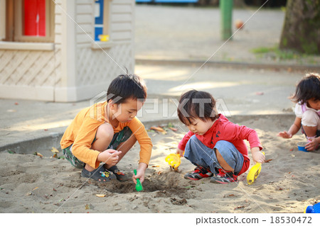 Children playing sandbag with friends 18530472
