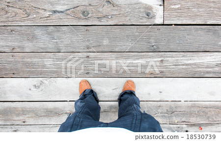 Leather shoe at an aerial view on wooden floors 18530739