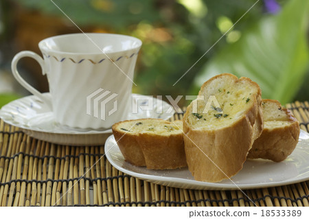 Garlic bread with cup of tea Garlic bread with cup of tea 18533389