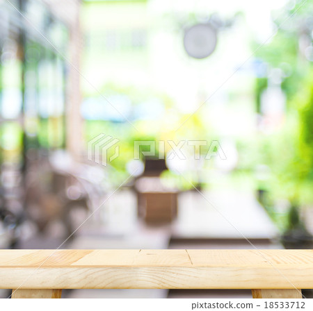 wood table and blurred cafe light background wood table and blurred cafe light background 18533712