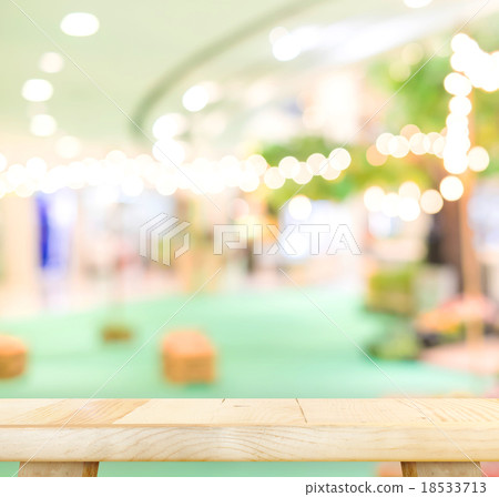 wood table and blurred cafe light background wood table and blurred cafe light background 18533713