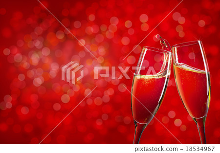 Two champagne glasses over christmas background Two champagne glasses over christmas background 18534967