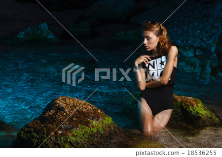Young teen girl in sea fashion shoot at sunset Young teen girl in sea fashion shoot at sunset 18536255
