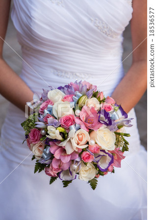 Beautiful wedding a bouquet in hands of the bride Beautiful wedding a bouquet in hands of the bride 18536577