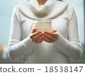 Woman holds a winter cup close up. Woman hands 18538147