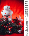 Christmas white lantern is standing with a burning 18538173
