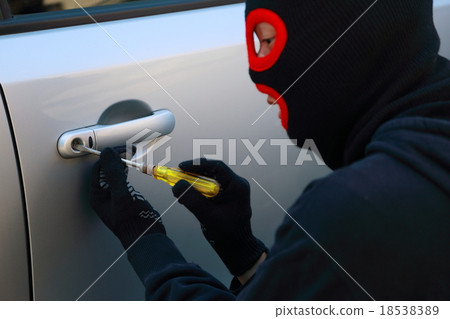 One man (car crime thief crime criminal illegal culprit villain theft eyed out hat disguised suspect case criminal) 18538389