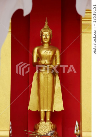 Buddha statue at temple. Red wall background. 18539151