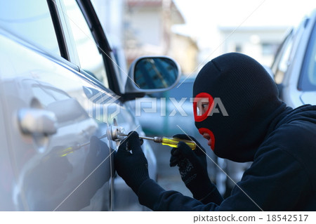 One man (car crime thief crime criminal illegal culprit villain theft eyed out hat disguised suspect case criminal) 18542517