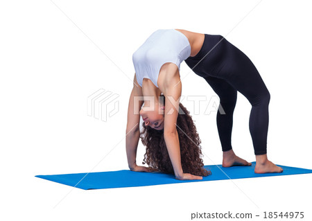 Studio shot of a young fit woman doing yoga 18544975