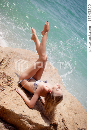 Beautiful girl on the beach 18545200