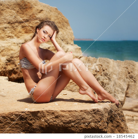 Young woman on the beach Young woman on the beach 18545462