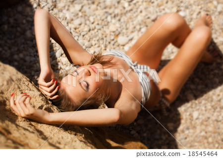 Young woman on the beach Young woman on the beach 18545464
