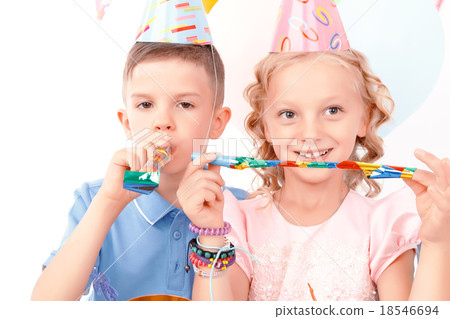 Little boy and girl during birthday party Little boy and girl during birthday party 18546694