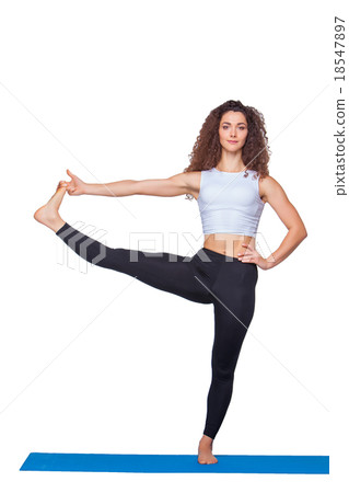 Studio shot of a young fit woman doing yoga 18547897