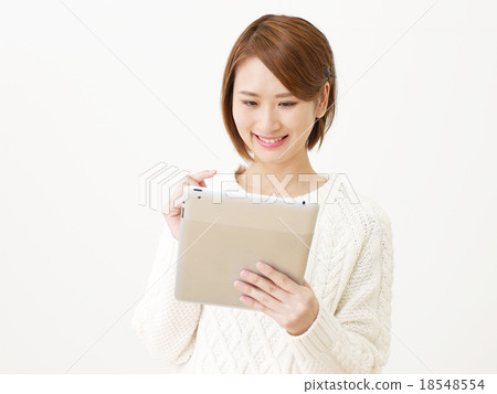 A woman with a tablet A woman with a tablet 18548554