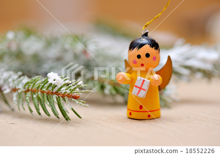 wooden Christmas angel with gift 18552226