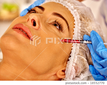 Woman middle-aged in spa salon with beautician Woman middle-aged in spa salon with beautician 18552770