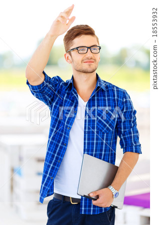 Nice freelancer holding notebook Nice freelancer holding notebook 18553932
