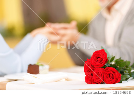 Nice adult couple sitting in the cafe Nice adult couple sitting in the cafe 18554698