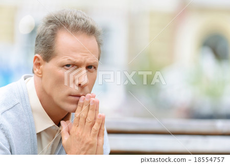 Pleasant man sitting on the bench Pleasant man sitting on the bench 18554757