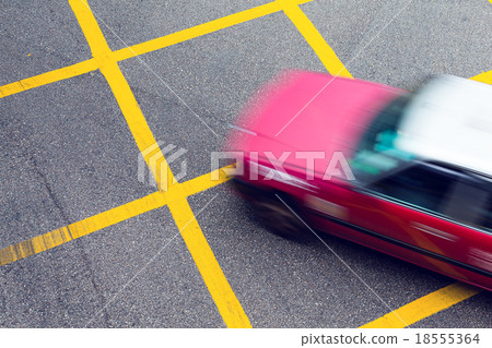 Motion blurred Taxi in Hong Kong Motion blurred Taxi in Hong Kong 18555364