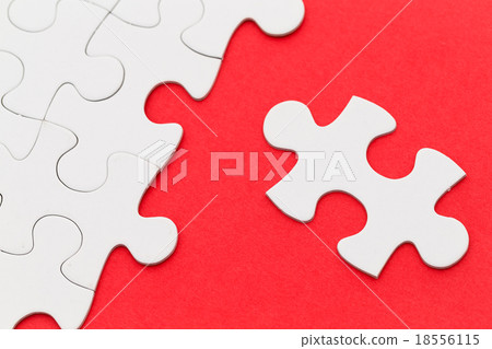 Incomplete white puzzle with red color background with copyspace Incomplete white puzzle with red color background with copyspace 18556115