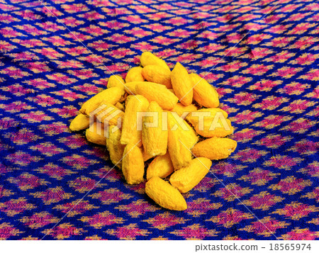 Close up silkworm cocoon on messaline. 18565974