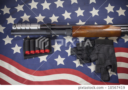 Shotgun American flag background. 18567419