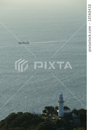 Tsurugi-saki lighthouse and cargo ship 18568438