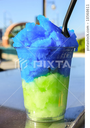 Snow cone in plastic cup. 18568611