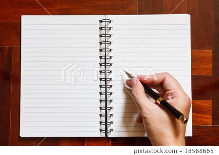 Hand write on notebook with pen. Hand write on notebook with pen. 18568665