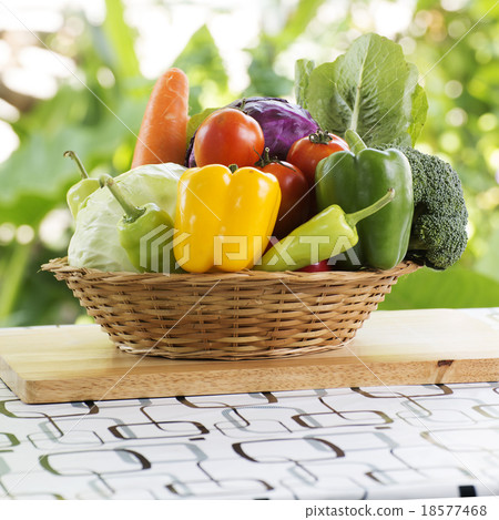 Set fresh vegetables on the basket 18577468