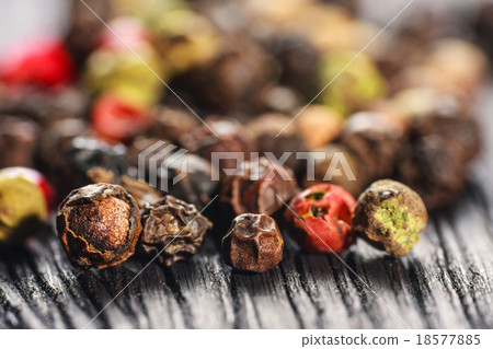 pepper corns on a wooden board 18577885
