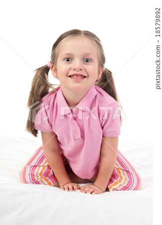 cheerful girl in bed 18579892