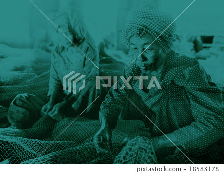 Cambodian women repairing fishing nets culture Concept 18583178