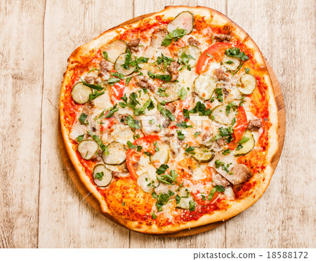pizza on the wood background pizza on the wood background 18588172