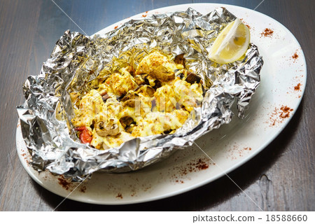 fish with vegetables in the foil 18588660