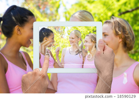 Composite image of hand holding tablet pc 18590129