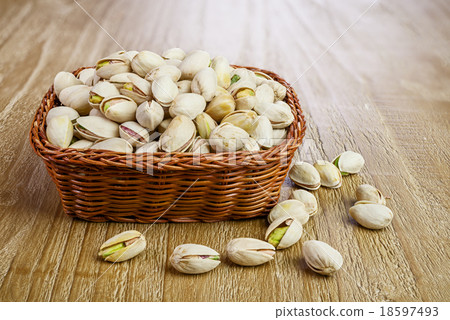 Pistachios on wooden table 18597493