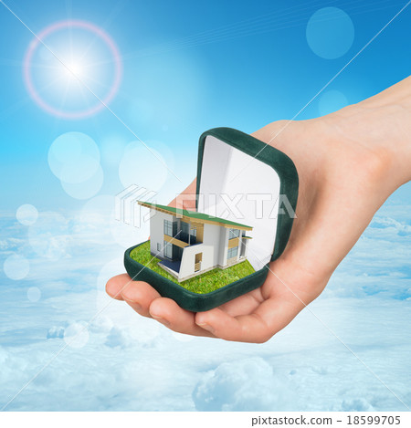 Empty green ring box with house in humans hand 18599705
