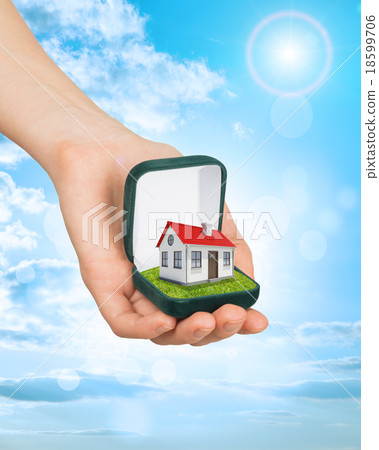 Empty ring box with red house in humans hand Empty ring box with red house in humans hand 18599706